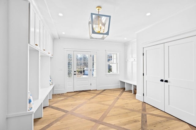 mudroom featuring recessed lighting, a notable chandelier, and baseboards