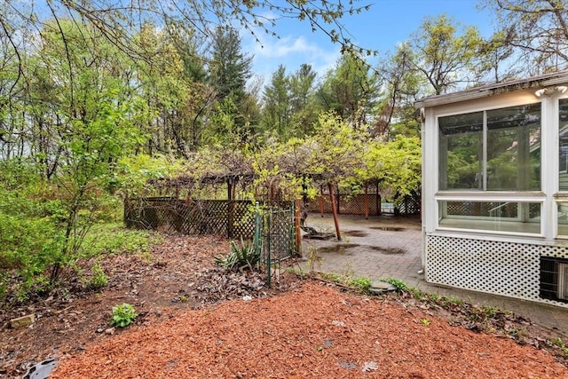 view of yard featuring fence and a patio area