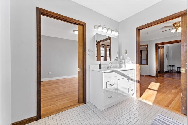 bathroom featuring tile patterned flooring, vanity, and ceiling fan