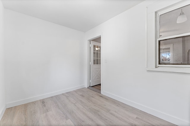 spare room with light hardwood / wood-style flooring