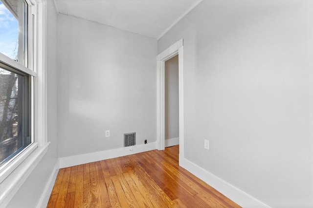 unfurnished room featuring light hardwood / wood-style floors