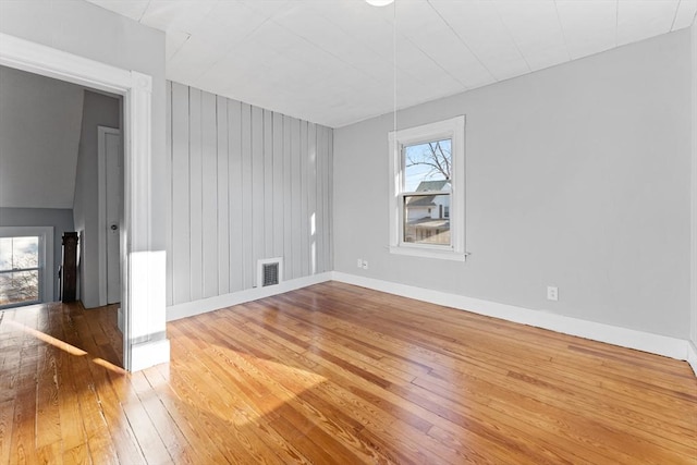 spare room featuring hardwood / wood-style flooring