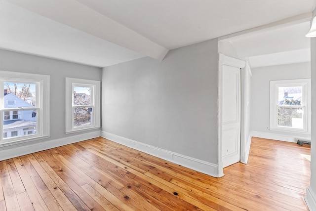 spare room featuring light hardwood / wood-style flooring