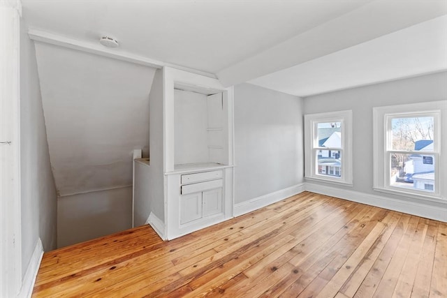 bonus room with light hardwood / wood-style flooring