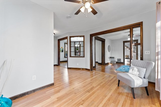 sitting room featuring ceiling fan and light wood-type flooring