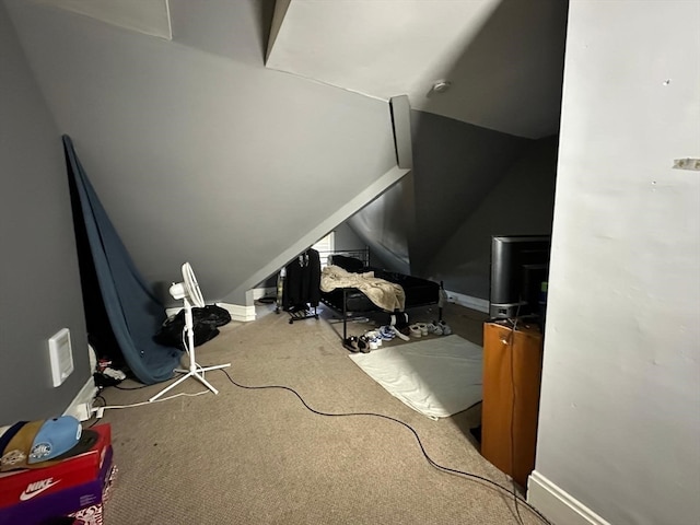 bonus room featuring carpet flooring and vaulted ceiling