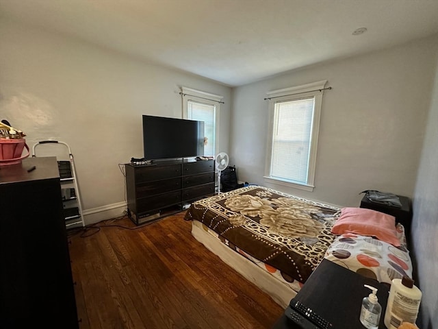 bedroom featuring dark hardwood / wood-style flooring