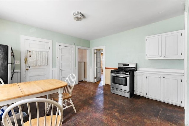 kitchen featuring light countertops, white cabinetry, and stainless steel appliances