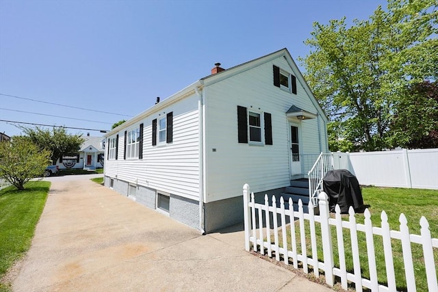 view of front of home featuring a chimney