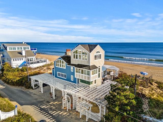 bird's eye view with a water view and a beach view