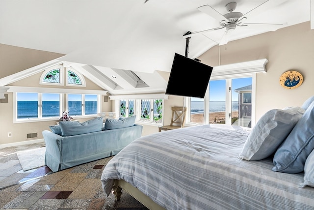 bedroom with lofted ceiling, a water view, and ceiling fan