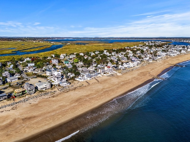 bird's eye view with a water view and a view of the beach