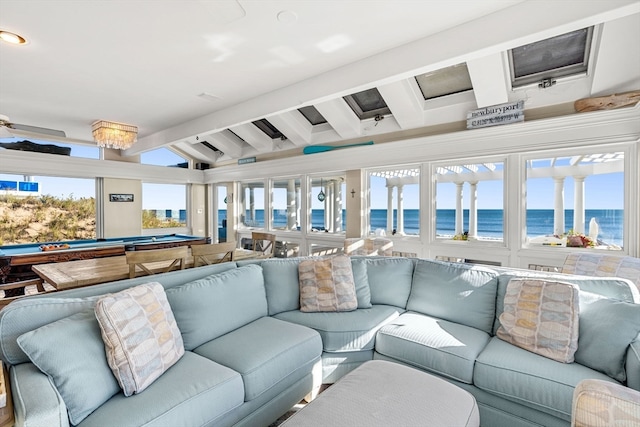 living room featuring pool table, vaulted ceiling with beams, a water view, and a wealth of natural light