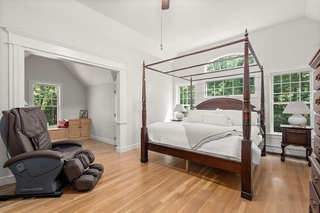 4 Country Way, Hopkinton, MA 01748 - bedroom featuring vaulted ceiling, light wood finished floors, multiple windows, a ceiling fan, and a baseboard heating unit