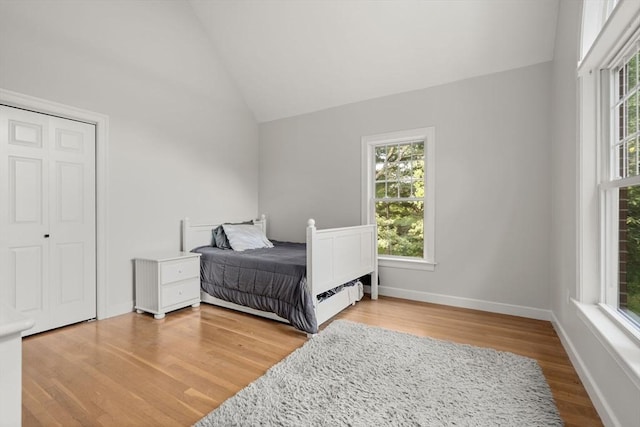 4 Country Way, Hopkinton, MA 01748 - bedroom featuring multiple windows, wood finished floors, and vaulted ceiling