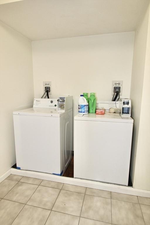 239 Union St, Franklin, MA 02038 - laundry area with washer and clothes dryer, light tile patterned floors, and baseboards