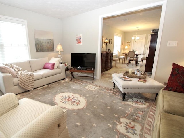 239 Union St, Franklin, MA 02038 - living room with a chandelier and carpet floors