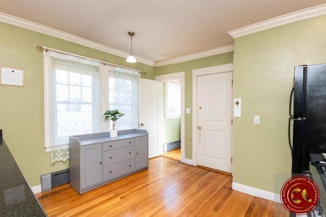 interior space with gray cabinets, light wood-type flooring, freestanding refrigerator, and ornamental molding