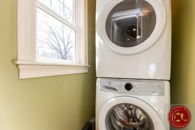 laundry room featuring laundry area and stacked washing maching and dryer