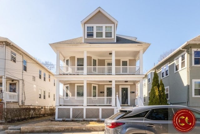 view of front of house with a porch and a balcony