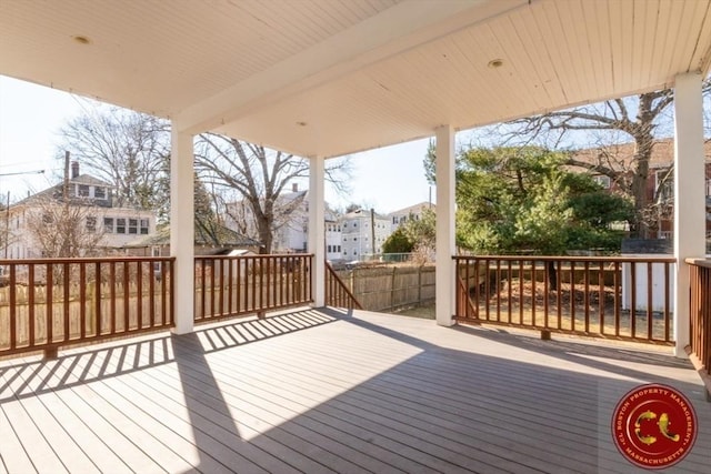 deck featuring a residential view and fence