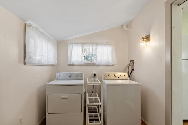 laundry room with washing machine and clothes dryer