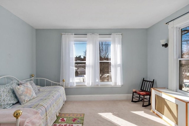 carpeted bedroom with radiator