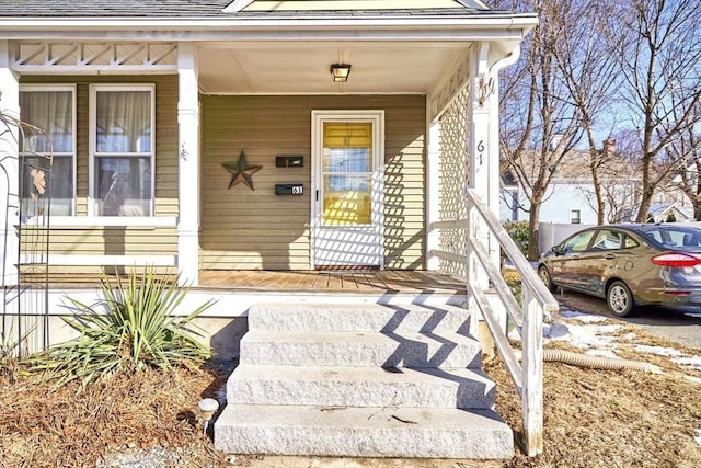 property entrance featuring covered porch