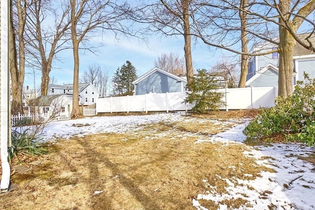 view of yard covered in snow