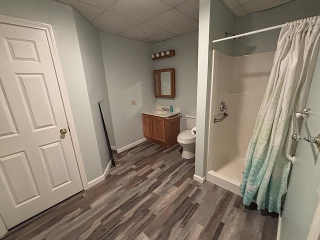 bathroom featuring hardwood / wood-style flooring, a paneled ceiling, vanity, and a shower with shower curtain