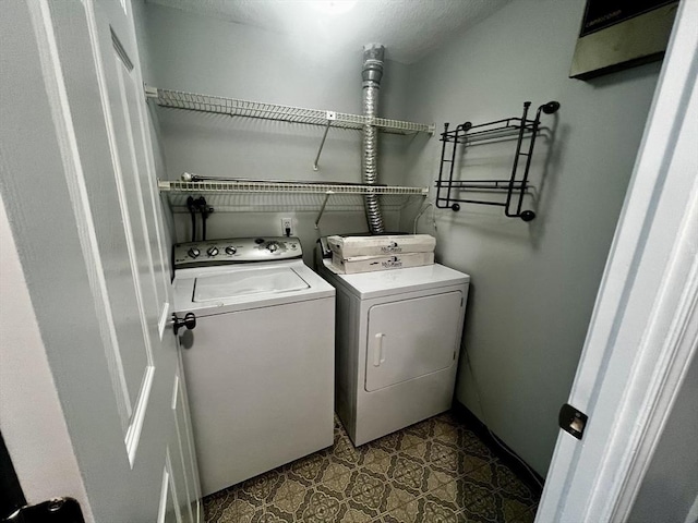 laundry room with washing machine and dryer