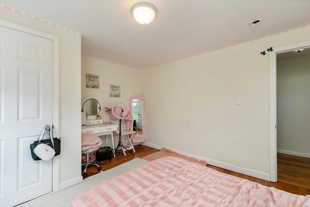701 Nashua Rd, Dracut, MA 01826 - bedroom with baseboards and wood finished floors