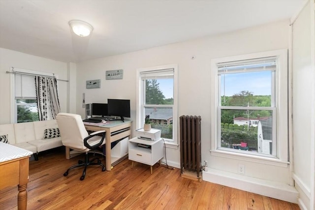 701 Nashua Rd, Dracut, MA 01826 - office space featuring radiator, light wood finished floors, and baseboards