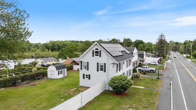 701 Nashua Rd, Dracut, MA 01826 - view of home's exterior featuring roof mounted solar panels and roof with shingles