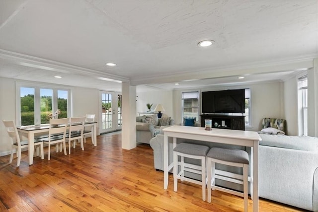 701 Nashua Rd, Dracut, MA 01826 - living area featuring french doors, healthy amount of natural light, light wood-type flooring, crown molding, and recessed lighting