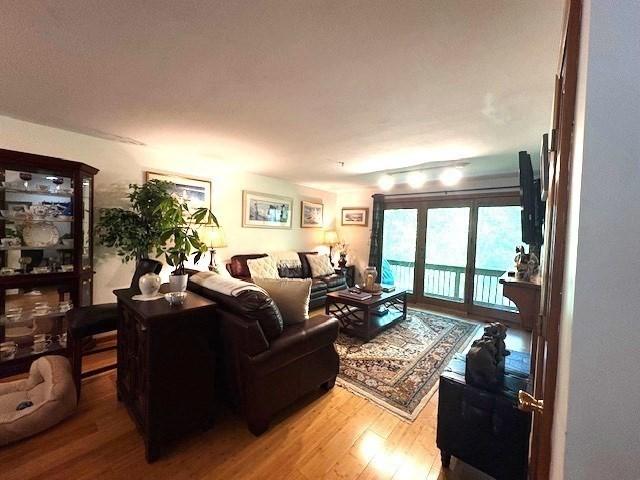 66 Schooner Lndg Unit 66, Hampton, NH 03842 - living room featuring wood finished floors