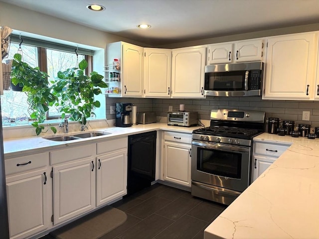 66 Schooner Lndg Unit 66, Hampton, NH 03842 - kitchen with appliances with stainless steel finishes, a sink, decorative backsplash, white cabinets, and recessed lighting