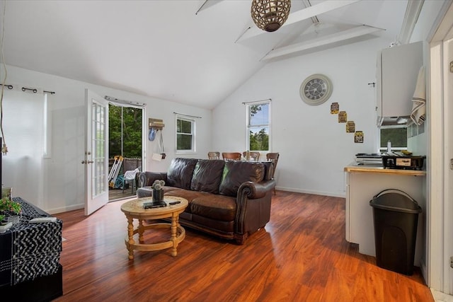 452 Nathan Ellis Hwy, Mashpee, MA 02649 - living area featuring wood finished floors, beam ceiling, healthy amount of natural light, a ceiling fan, and high vaulted ceiling