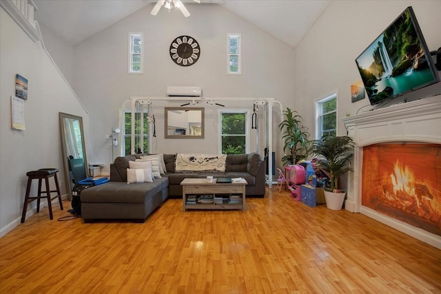 452 Nathan Ellis Hwy, Mashpee, MA 02649 - living area featuring high vaulted ceiling, light wood finished floors, a ceiling fan, and healthy amount of natural light