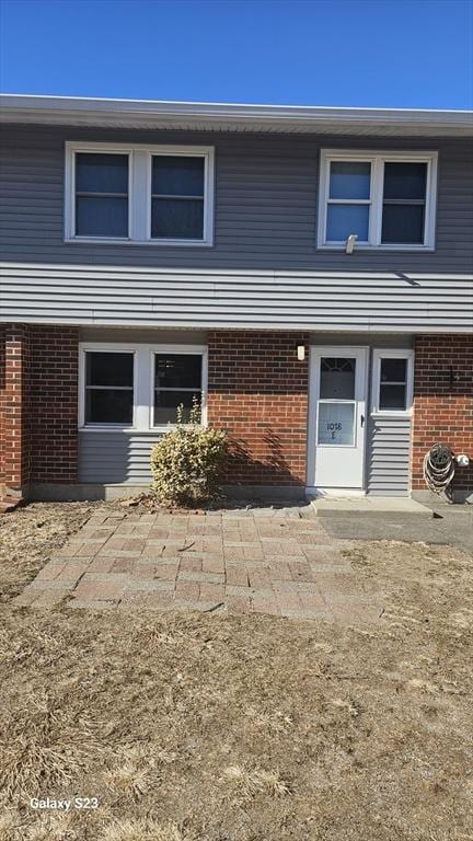 view of front of house with brick siding