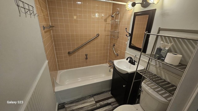 bathroom featuring shower / washtub combination, toilet, and vanity