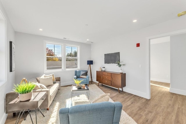 living room with light hardwood / wood-style floors