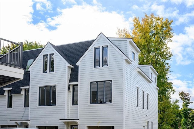 rear view of house featuring a balcony