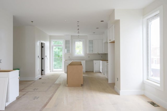 kitchen with white cabinetry and a kitchen island