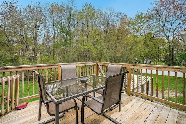 wooden deck with outdoor dining space