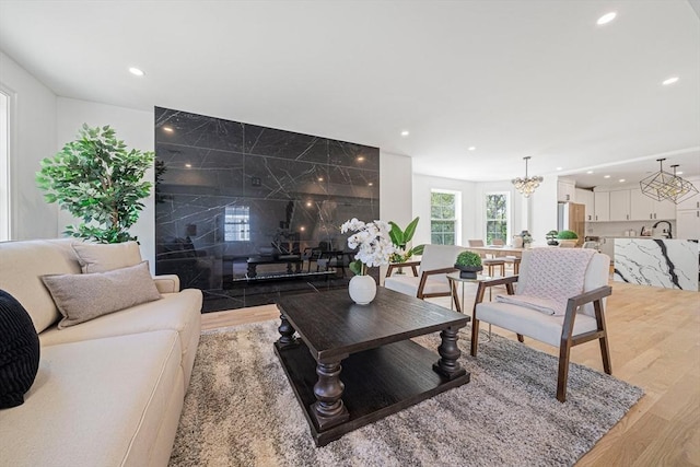 1135-1137 Hyde Park Ave Unit 1, Boston, MA 02136 - living area with light wood-type flooring, recessed lighting, and a chandelier