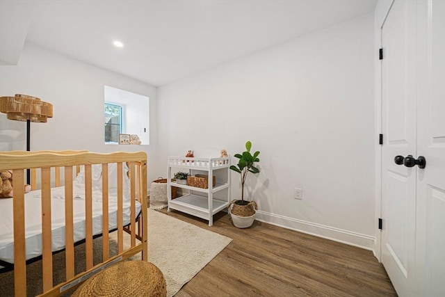 1135-1137 Hyde Park Ave Unit 1, Boston, MA 02136 - bedroom with wood finished floors, baseboards, and recessed lighting