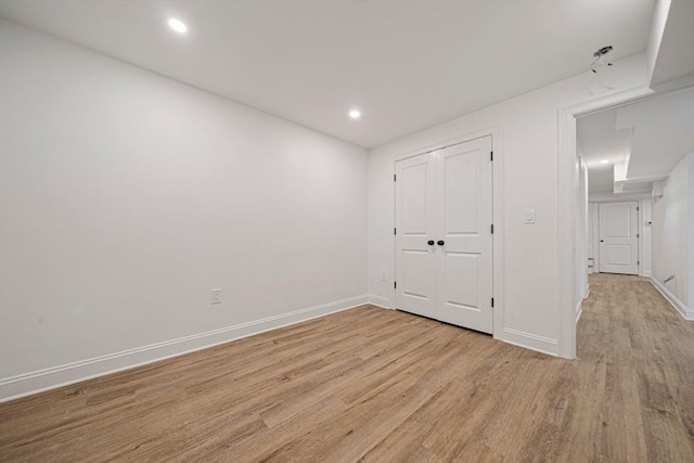 1135-1137 Hyde Park Ave Unit 1, Boston, MA 02136 - unfurnished bedroom with light wood-type flooring, baseboards, recessed lighting, and a closet