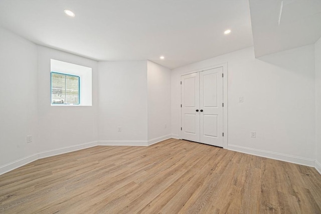 1135-1137 Hyde Park Ave Unit 1, Boston, MA 02136 - unfurnished bedroom featuring light wood-style flooring, baseboards, recessed lighting, and a closet