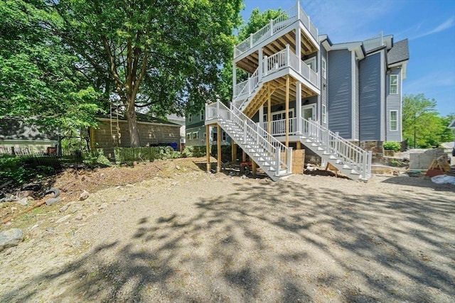 1135-1137 Hyde Park Ave Unit 1, Boston, MA 02136 - rear view of property with stairway and a balcony